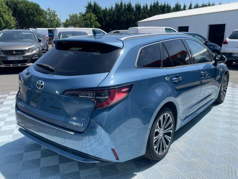 Photo 3 de l'offre de TOYOTA COROLLA XII TOURING SPORTS 1.8 HYBRIDE 122H BVA PREMIUM CUIR 4SC Hayon EL. JA17 à 24590€ chez Mérignac auto
